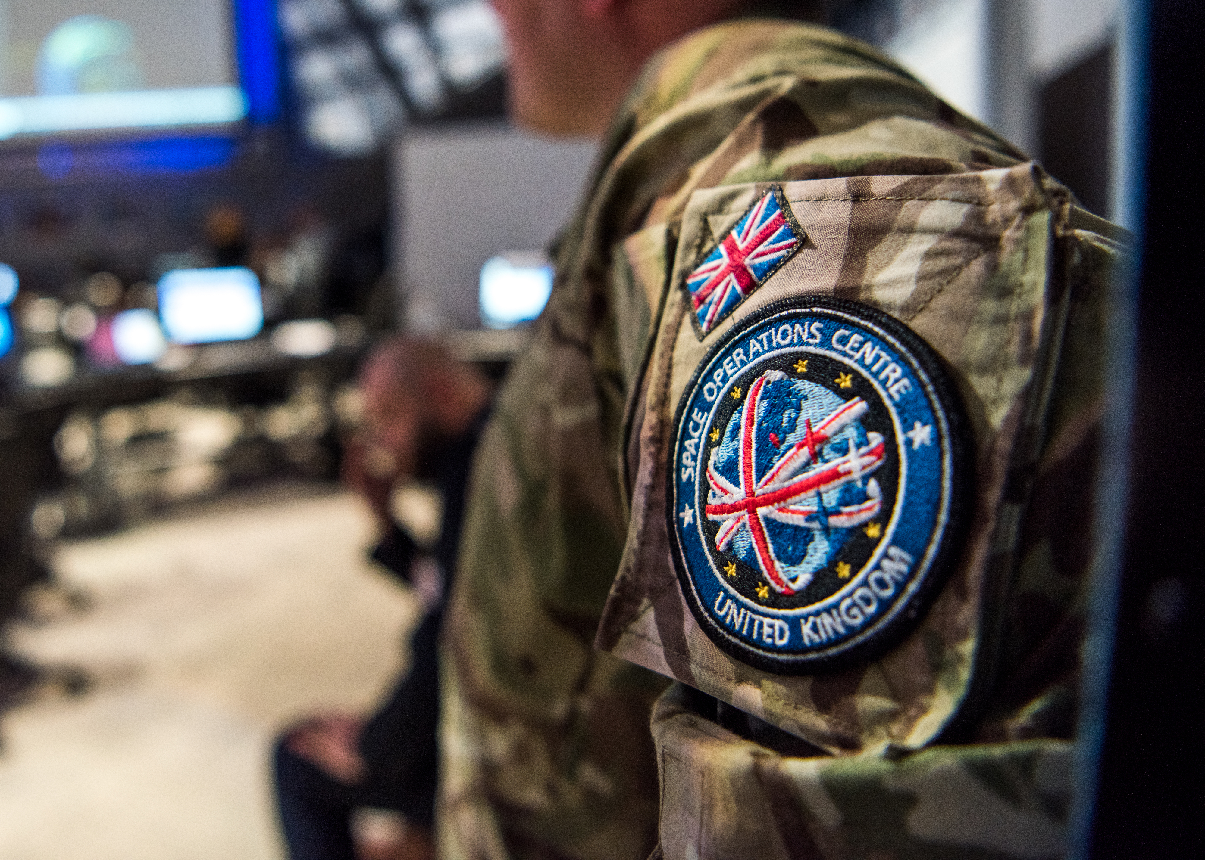 Badge of UK Space Command on uniform.